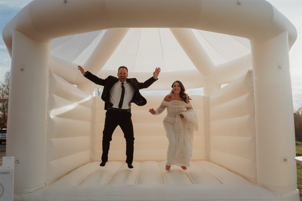 Roanoke Wedding Venues, a couple jumping in a bouncy house